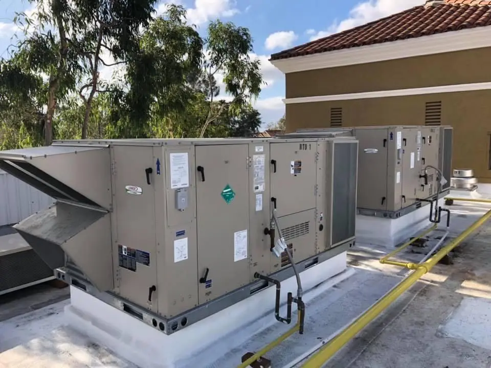 A large commercial air conditioner on top of the roof.